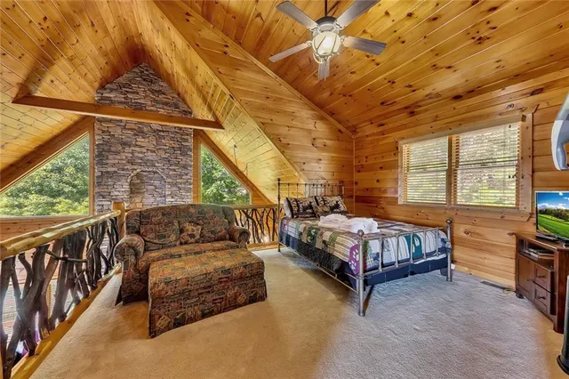 a bedroom with furniture and a window