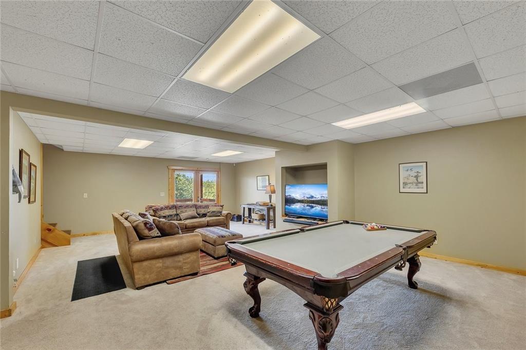 499 Raven Ridge Circle Mineral Bluff, GA 30559 - Photo 21 of 43 a living room with furniture pool table and a window