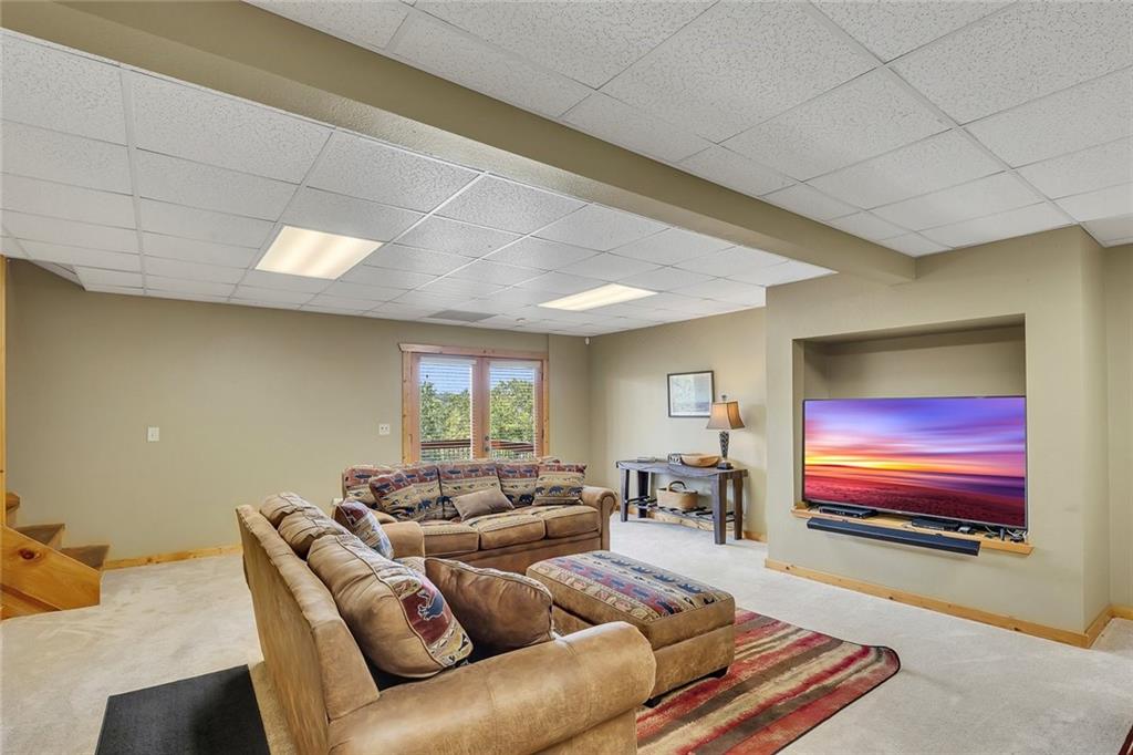499 Raven Ridge Circle Mineral Bluff, GA 30559 - Photo 23 of 43 a living room with furniture and a flat screen tv