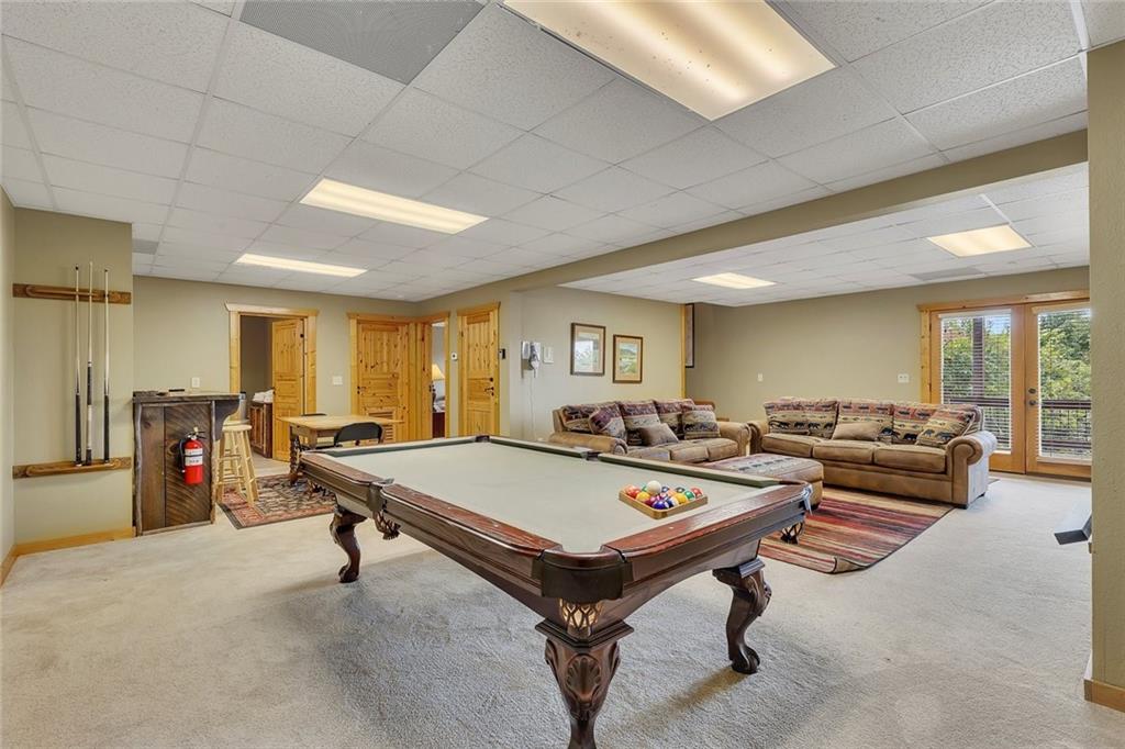 499 Raven Ridge Circle Mineral Bluff, GA 30559 - Photo 25 of 43 a living room with furniture pool table and a large window