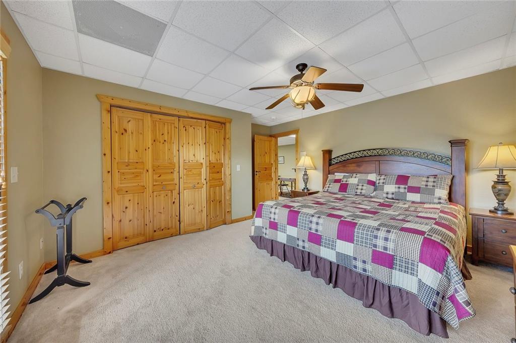 499 Raven Ridge Circle Mineral Bluff, GA 30559 - Photo 27 of 43 a bedroom with a bed next to a window