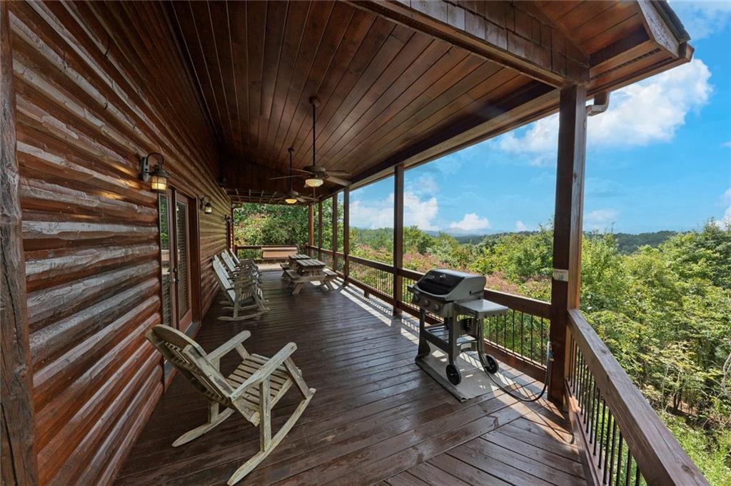 499 Raven Ridge Circle Mineral Bluff, GA 30559 - Photo 29 of 43 a view of a balcony with chairs