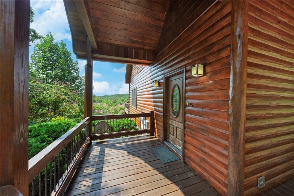 499 Raven Ridge Circle Mineral Bluff, GA 30559 - Photo 3 of 43 a view of a balcony with wooden floor