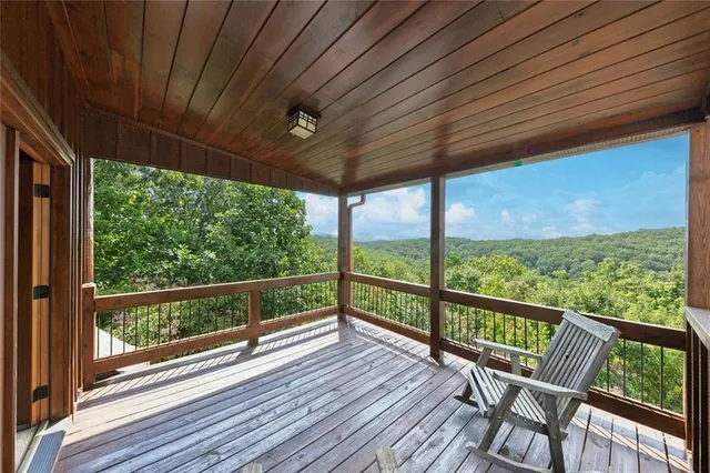 a view of a balcony with wooden floor