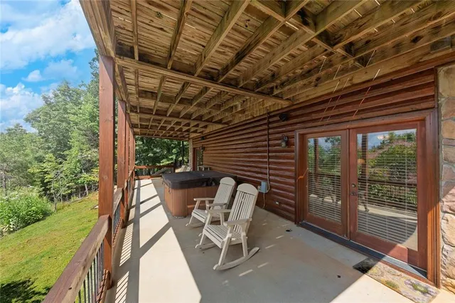 a view of living room with balcony and furniture