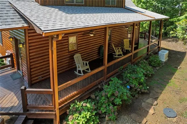 a view of a backyard with sitting area