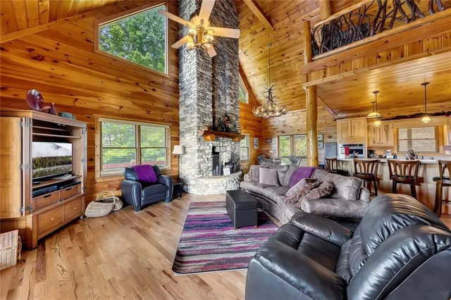 a outdoor living space with patio furniture and a fireplace