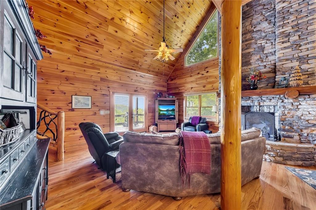 499 Raven Ridge Circle Mineral Bluff, GA 30559 - Photo 6 of 43 a living room with fireplace furniture and a fireplace