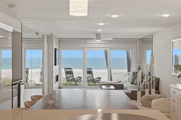 a view of a living room and kitchen floor