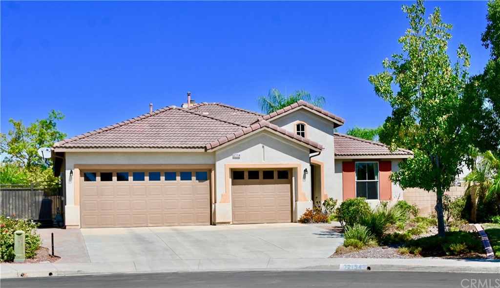 32154 Renoir Road Winchester, CA 92596 - Photo 1 of 1 a front view of a house with a garden