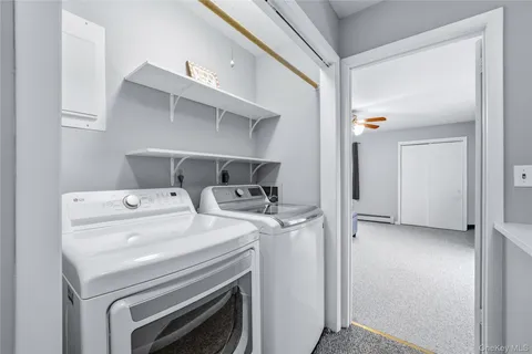 a view of storage and utility room with washer and dryer