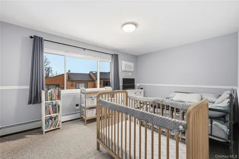 a bedroom with furniture and a window