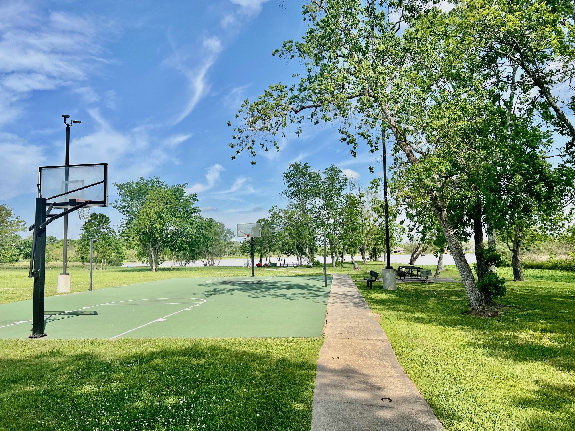 443 Lakeview Drive Angleton, TX 77515 - Photo 10 of 12 a park view with a clock tower in middle of a park