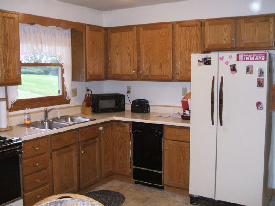 174 Lake Summerset Road Lake Summerset, IL 61019 - Photo 3 of 8 a kitchen with a sink a refrigerator and window