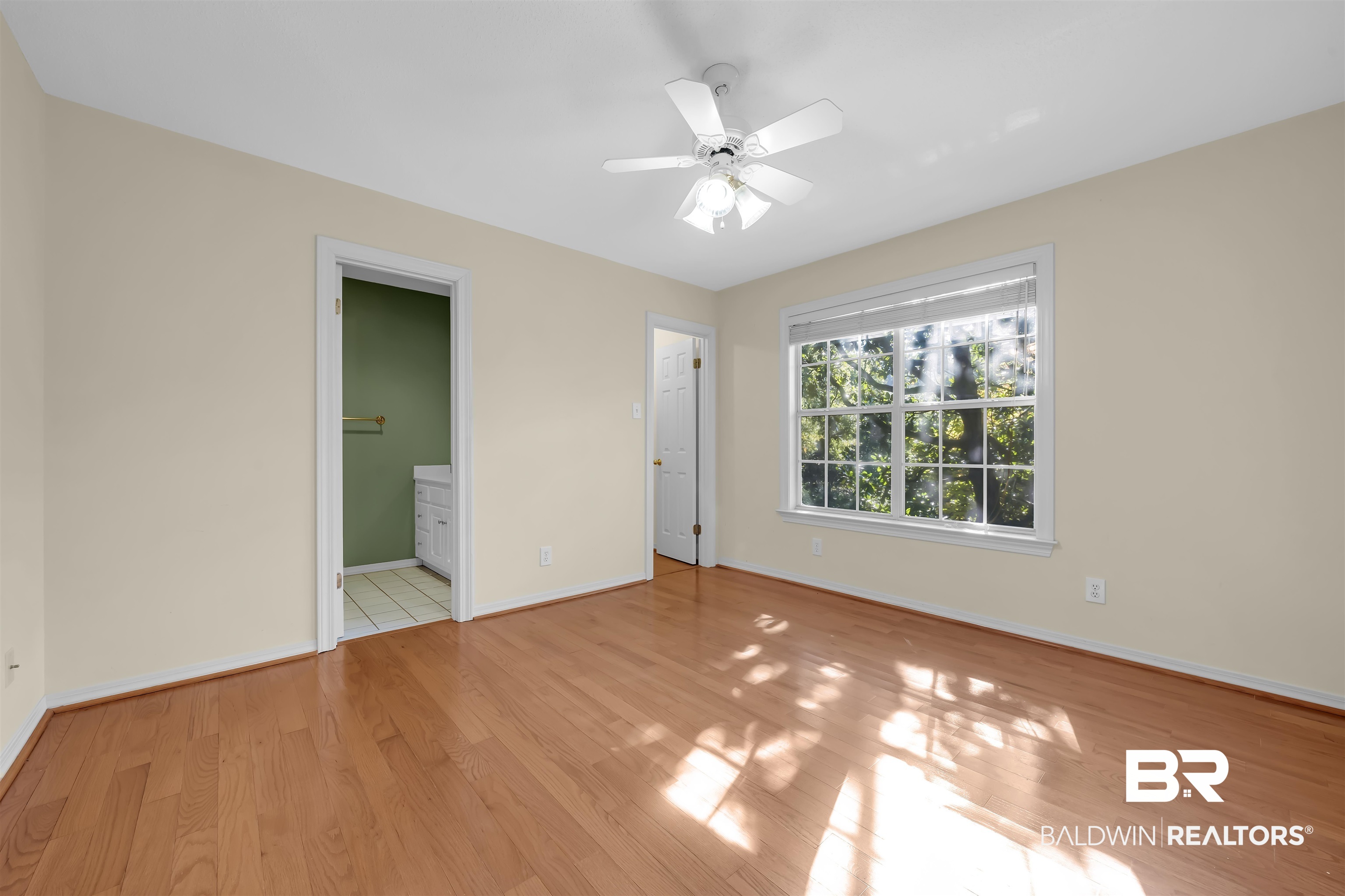 1262 Patrick Street Daphne, AL 36526 - Photo 21 of 35 Unfurnished bedroom with light wood-type flooring, ceiling fan, and ensuite bath