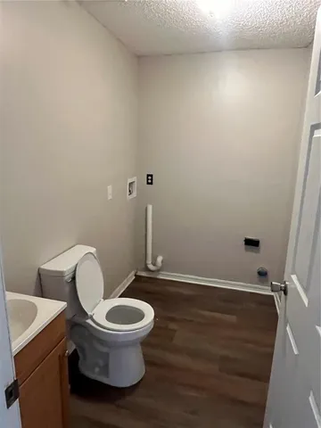 a bathroom with a toilet and a vanity