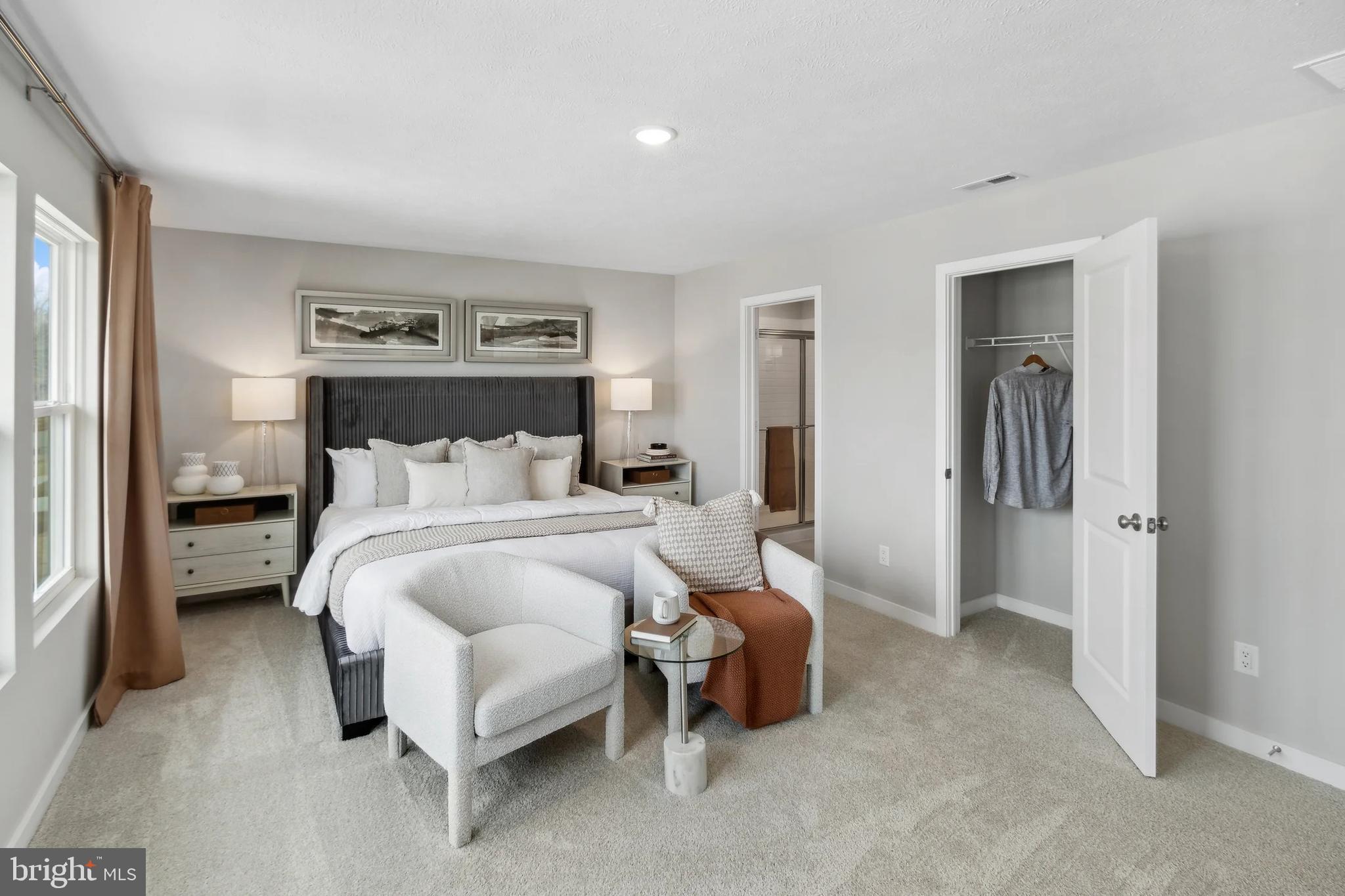 94 Thornton Avenue Ranson, WV 25438 - Photo 11 of 24 a bedroom with a bed and a view of bathroom