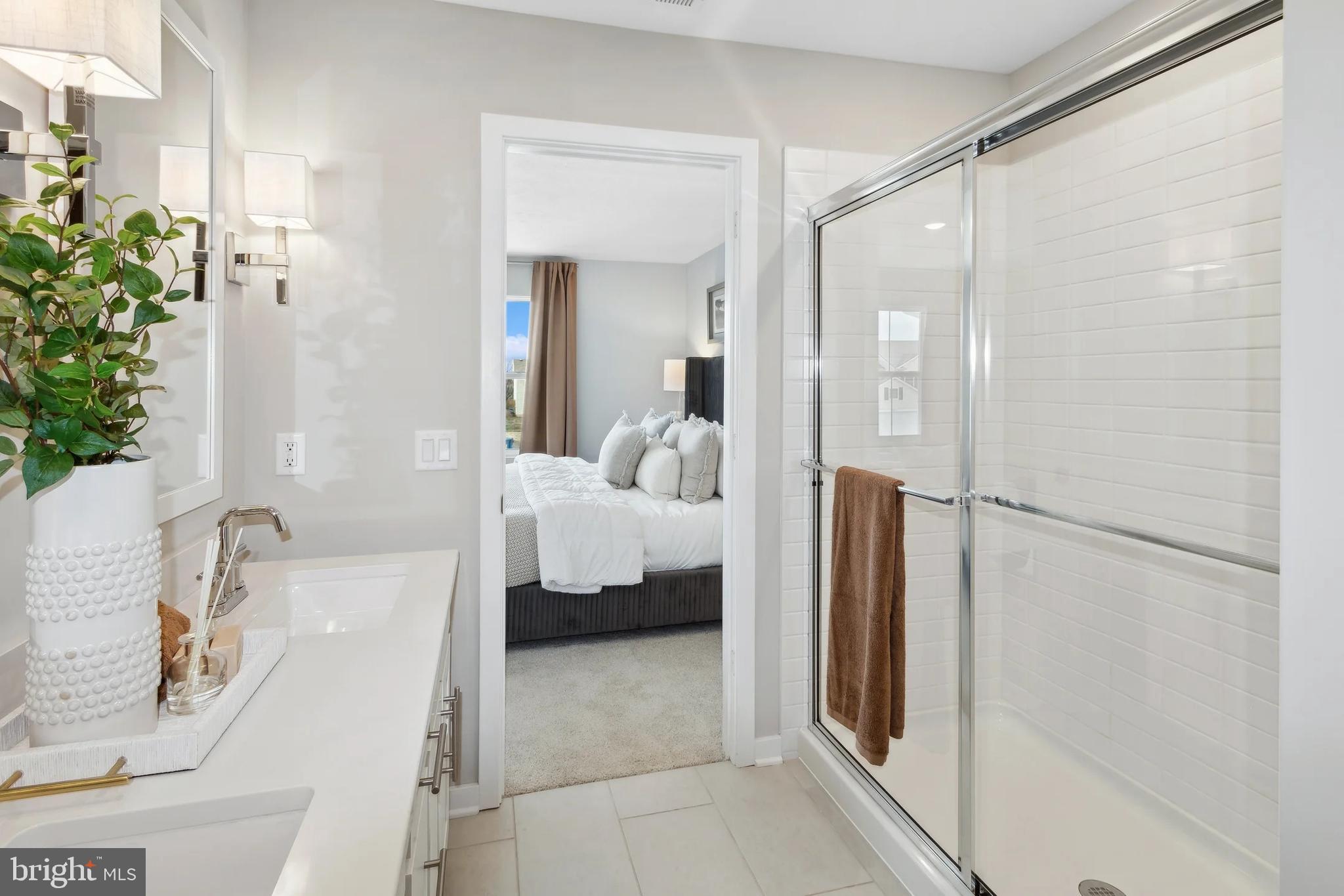 94 Thornton Avenue Ranson, WV 25438 - Photo 14 of 24 a en suite bathroom with a sink and a mirror