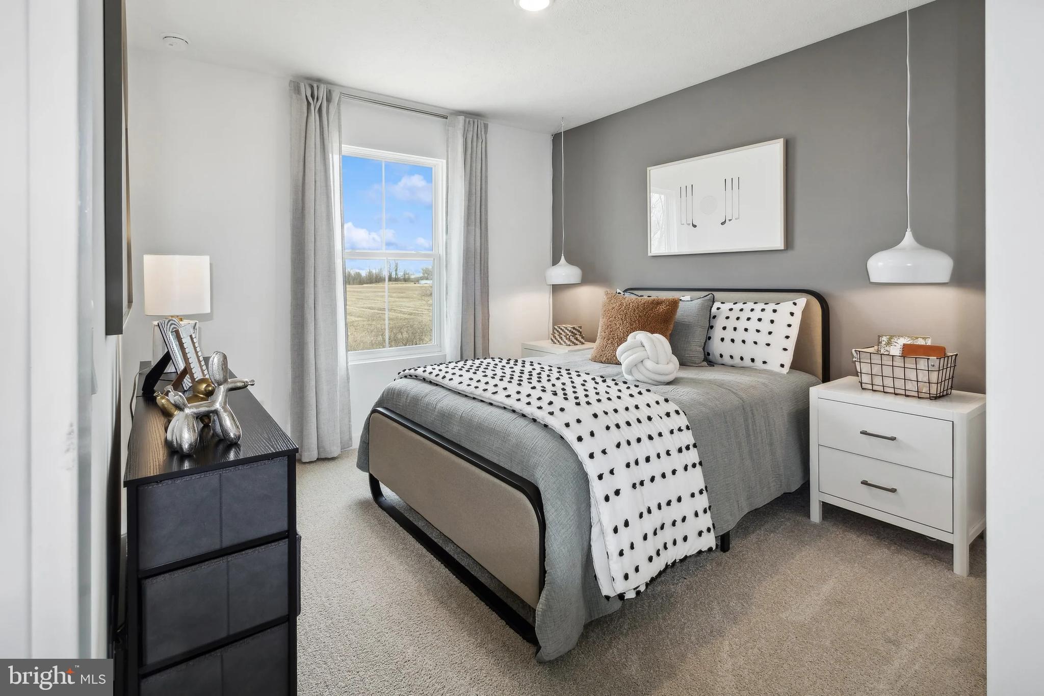 94 Thornton Avenue Ranson, WV 25438 - Photo 20 of 24 a bedroom with a bed and a lamp on dresser