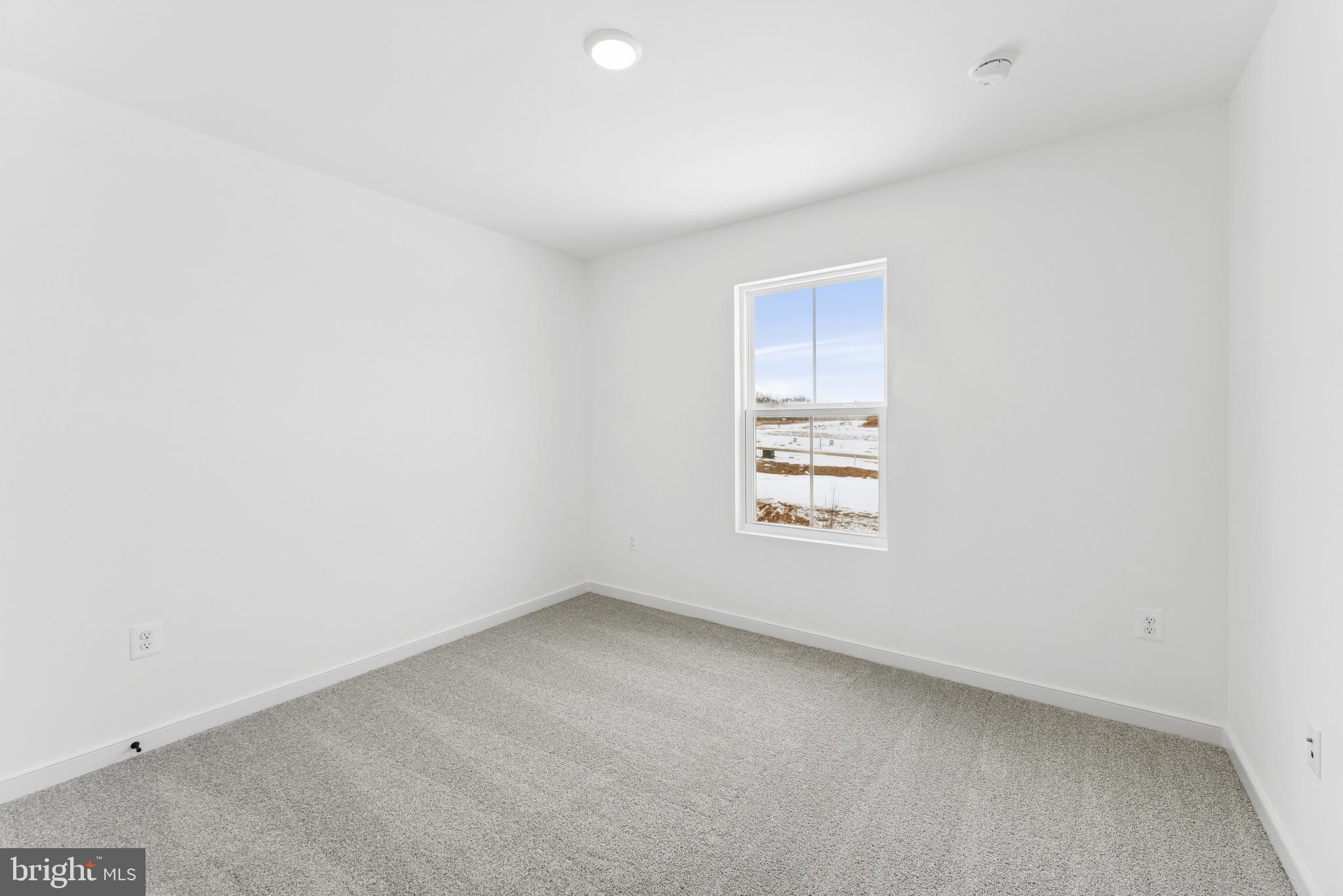 94 Thornton Avenue Ranson, WV 25438 - Photo 5 of 22 a view of an empty room with a window