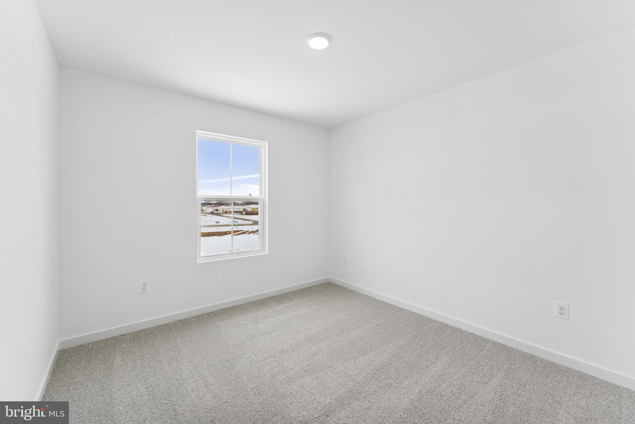 94 Thornton Avenue Ranson, WV 25438 - Photo 6 of 22 an empty room with a window