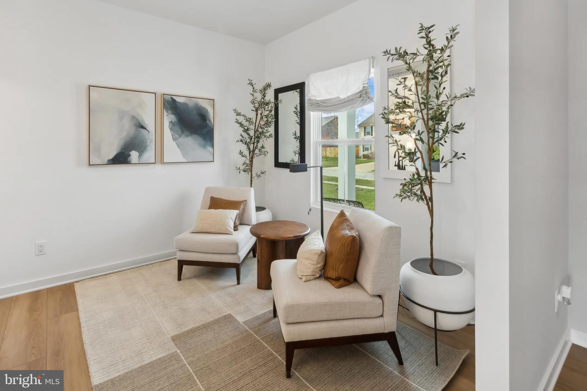 94 Thornton Avenue Ranson, WV 25438 - Photo 9 of 24 a living room with furniture and a potted plant