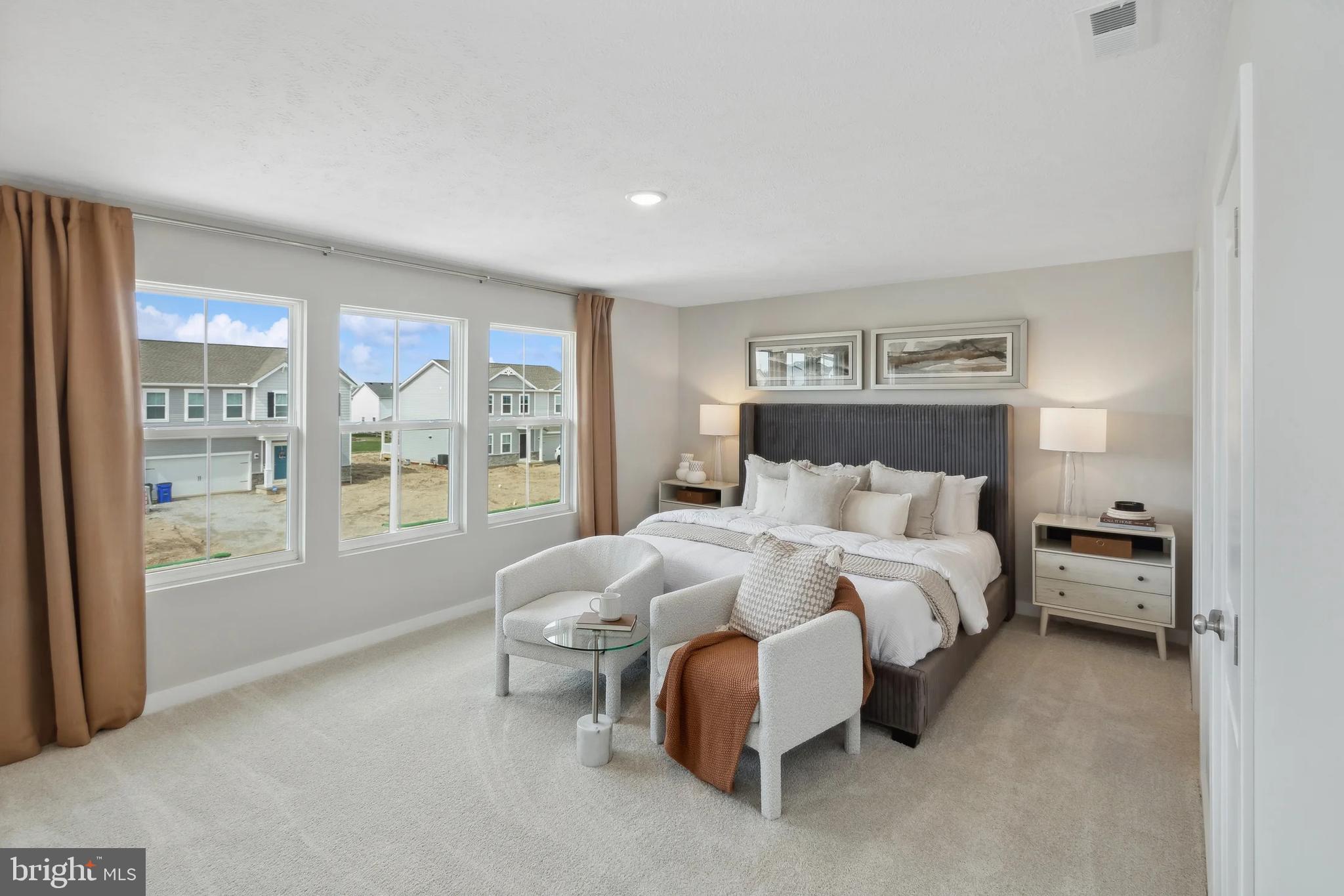 94 Thornton Avenue Ranson, WV 25438 - Photo 10 of 24 a bedroom with a bed and a large window