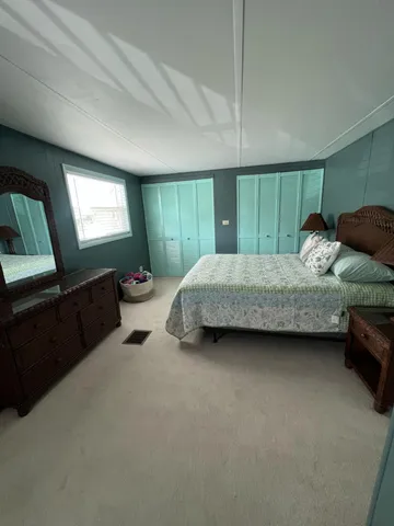 a bedroom with bed and window