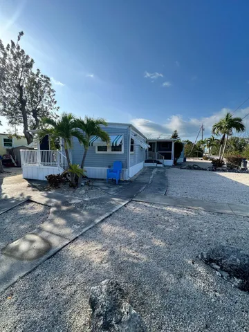 a view of a yard with table and chairs