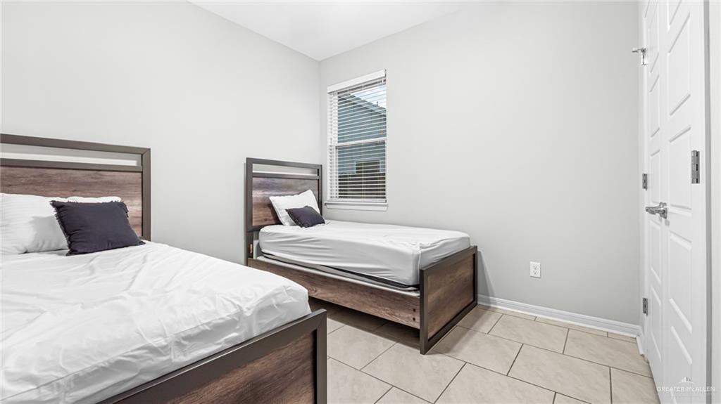 14208 Boykin Creek Road McAllen, TX 78504 - Photo 12 of 30 a bedroom with a bed and a window