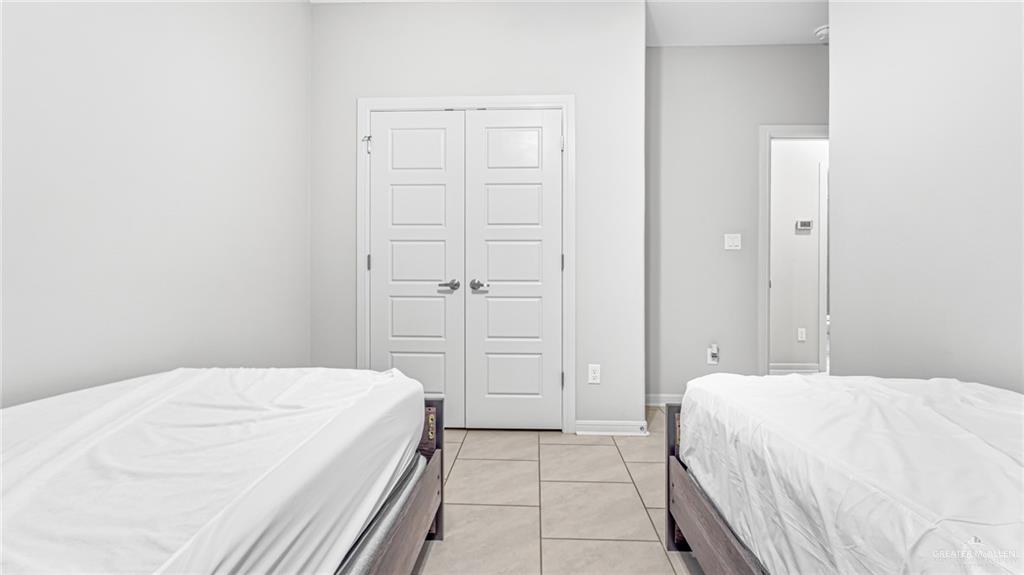 14208 Boykin Creek Road McAllen, TX 78504 - Photo 13 of 30 a bedroom with a bed and closet
