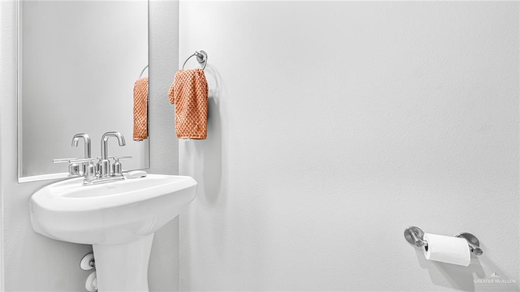 14208 Boykin Creek Road McAllen, TX 78504 - Photo 15 of 30 a bathroom with a sink and mirror