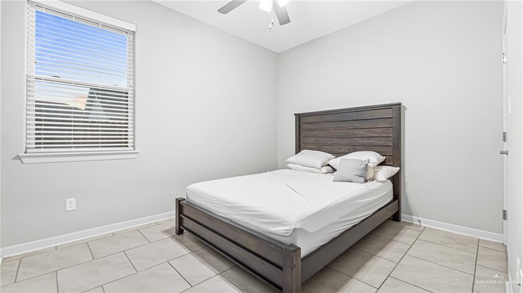 14208 Boykin Creek Road McAllen, TX 78504 - Photo 17 of 30 a white bed sitting in a bedroom next to a window