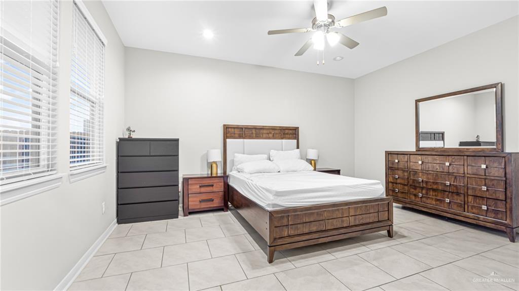 14208 Boykin Creek Road McAllen, TX 78504 - Photo 19 of 30 a bedroom with a bed and a dresser