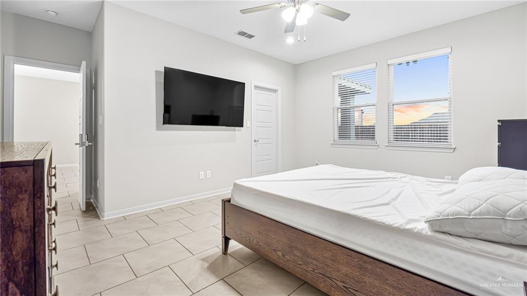 14208 Boykin Creek Road McAllen, TX 78504 - Photo 20 of 30 a bedroom with a bed and a flat screen tv