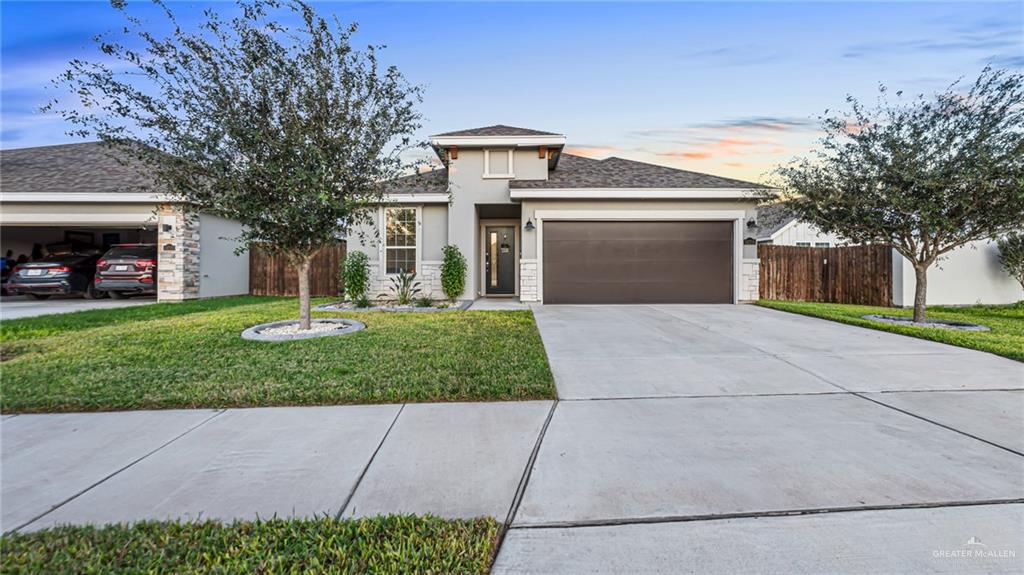 14208 Boykin Creek Road McAllen, TX 78504 - Photo 2 of 30 a front view of a house with a yard and garage
