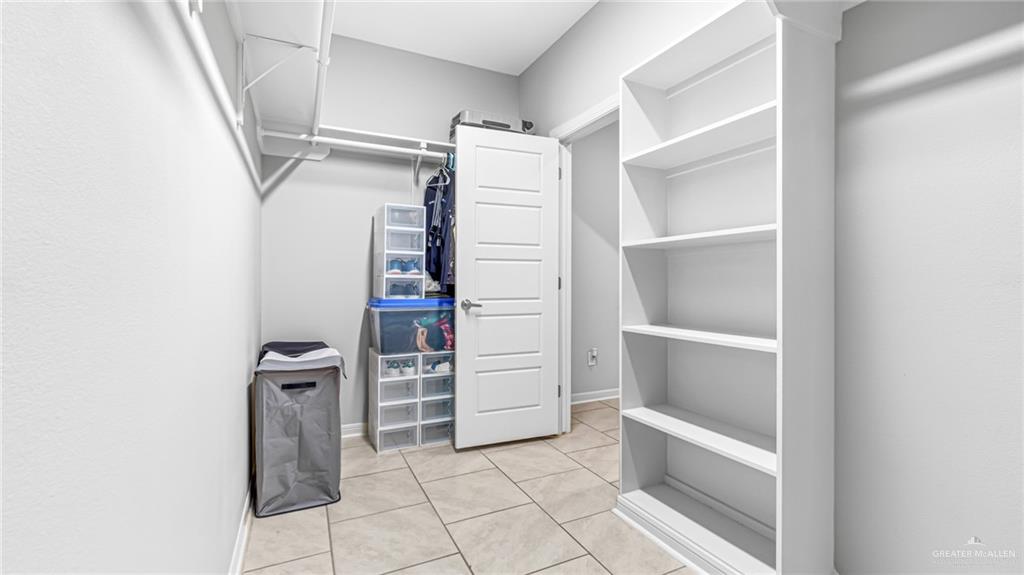 14208 Boykin Creek Road McAllen, TX 78504 - Photo 21 of 30 a view of walk in closet with empty racks