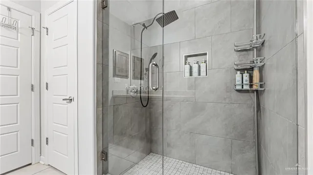 a spacious bathroom with a granite countertop sink and a mirror