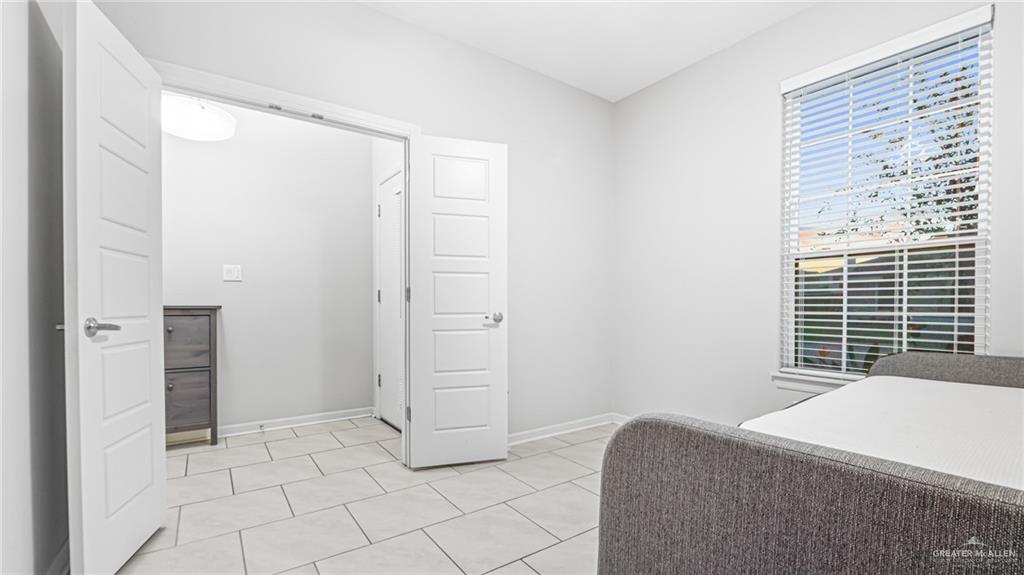 14208 Boykin Creek Road McAllen, TX 78504 - Photo 26 of 30 a bedroom with a bed and a window