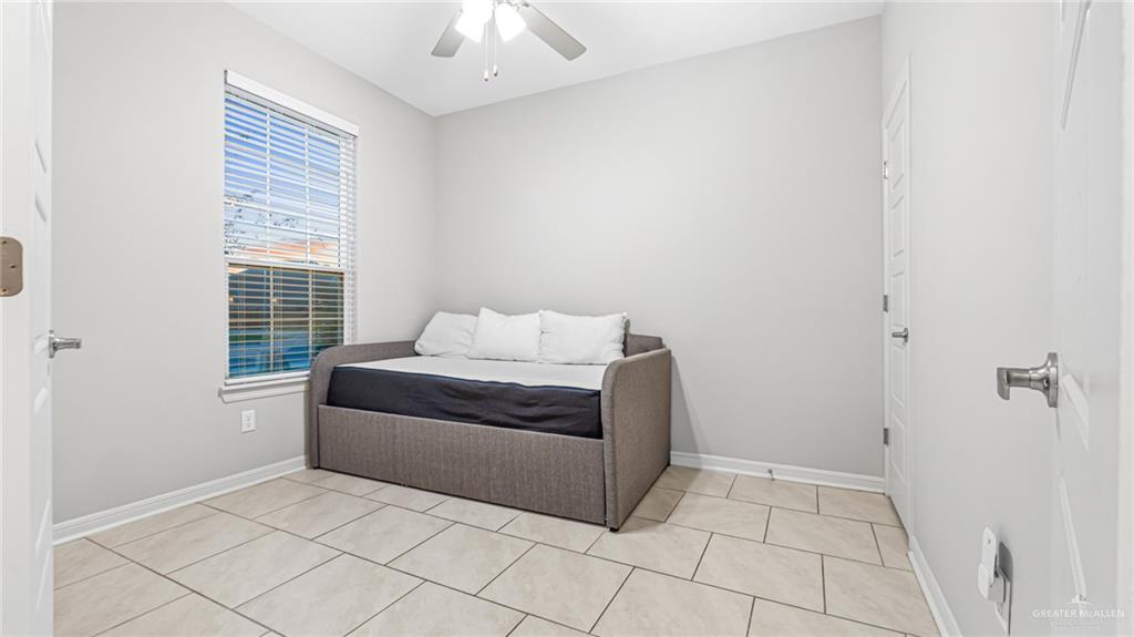 14208 Boykin Creek Road McAllen, TX 78504 - Photo 27 of 30 a living room with a couch