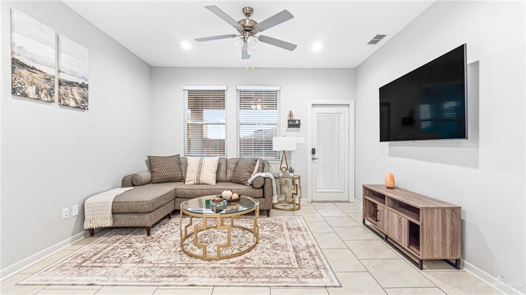14208 Boykin Creek Road McAllen, TX 78504 - Photo 3 of 30 a living room with furniture and a flat screen tv