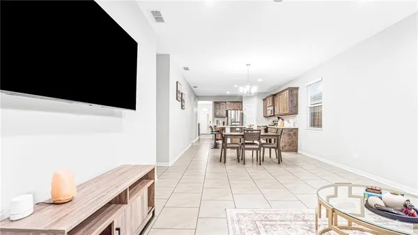 a view of a dining room with furniture and a window