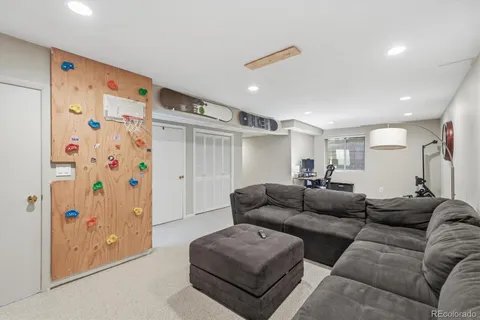 a living room with furniture and a rug