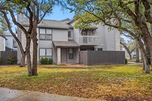 8406 Lyndon Lane, Unit A Austin, TX 78729 - Photo 1 of 1 Fourplex with trees, grass and balconies
