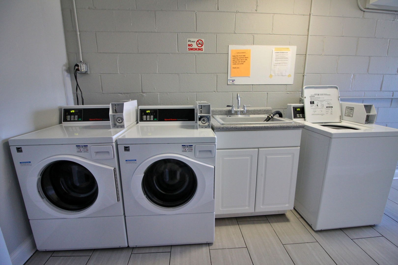 9418 Dee Road, Unit 2B Des Plaines, IL 60016 - Photo 16 of 21 a utility room with sink dryer and washer