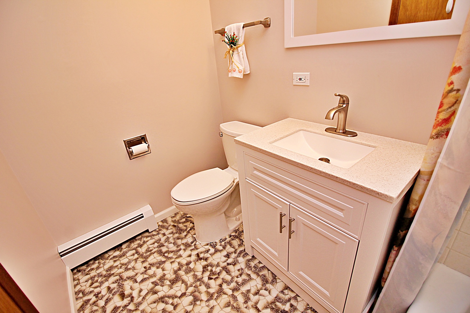 9418 Dee Road, Unit 2B Des Plaines, IL 60016 - Photo 8 of 21 a bathroom with a sink a toilet and mirror
