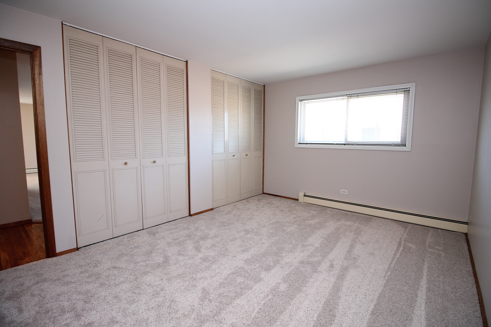 9418 Dee Road, Unit 2B Des Plaines, IL 60016 - Photo 10 of 21 a view of an empty room with a window