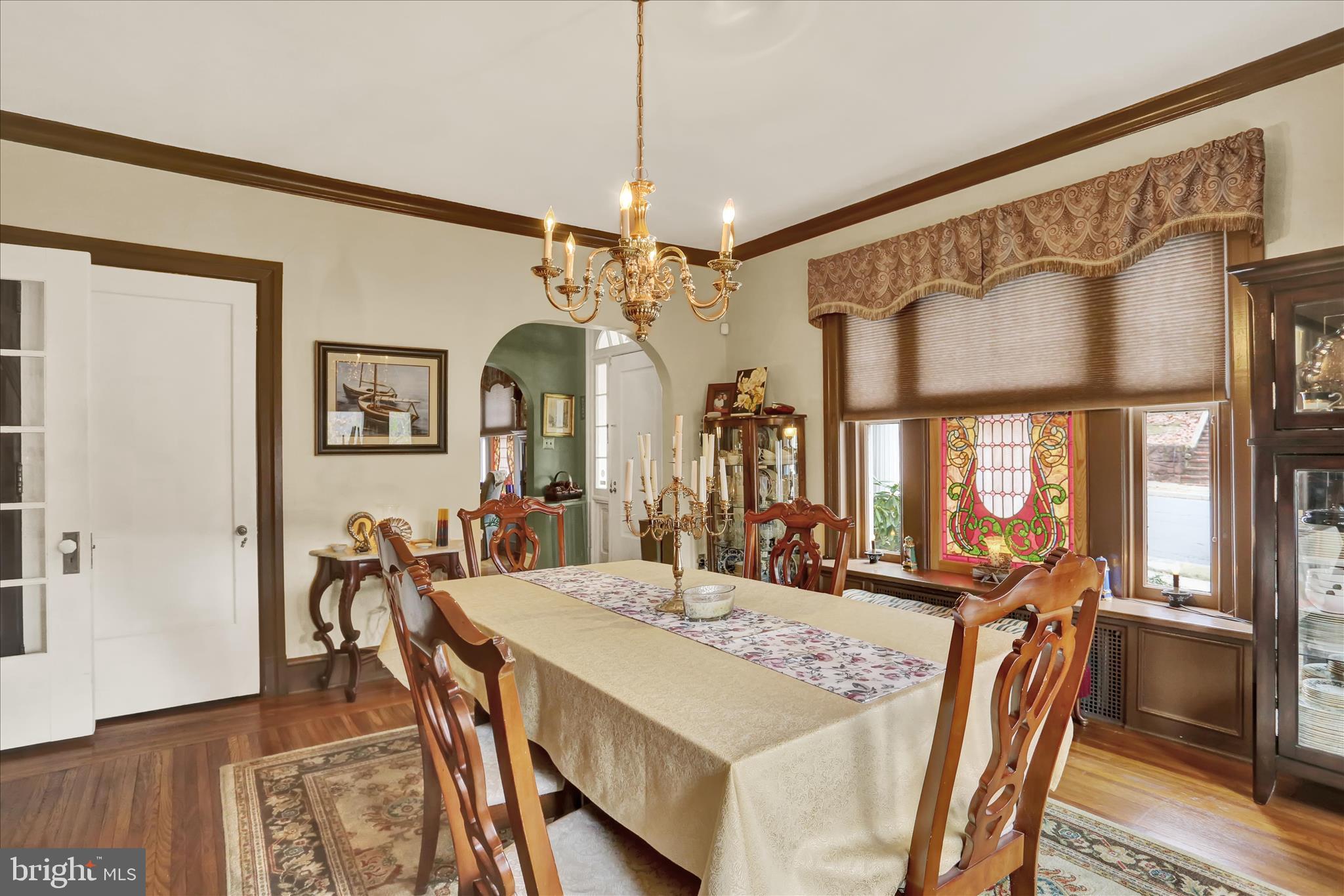 1810 Holly Road Reading, PA 19602 - Photo 14 of 52 a view of a dining room with furniture and a chandelier