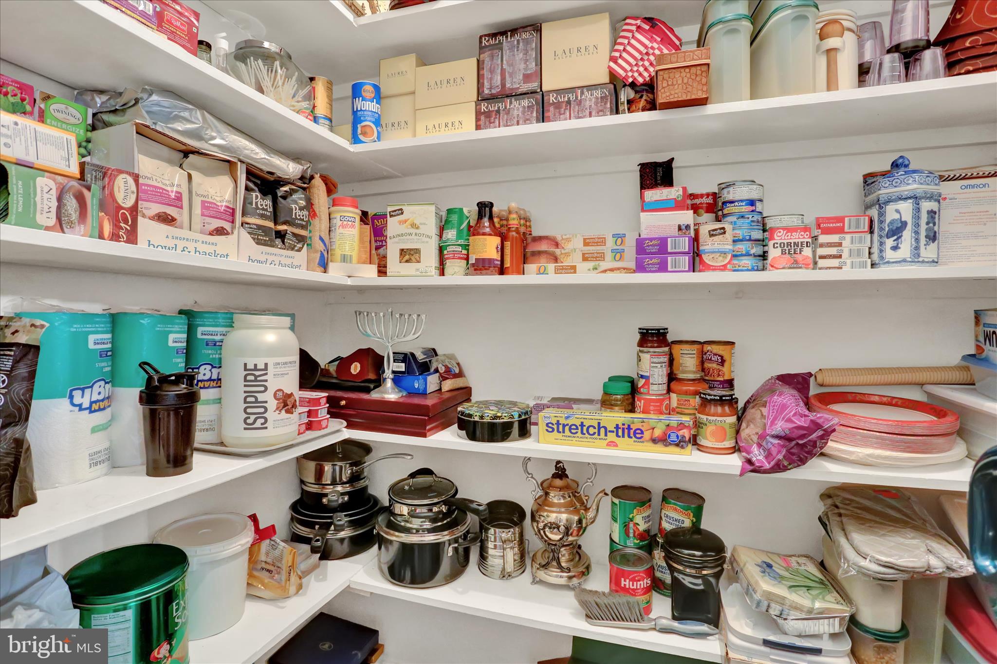 1810 Holly Road Reading, PA 19602 - Photo 15 of 52 a store room with lots of clutter and a white furniture