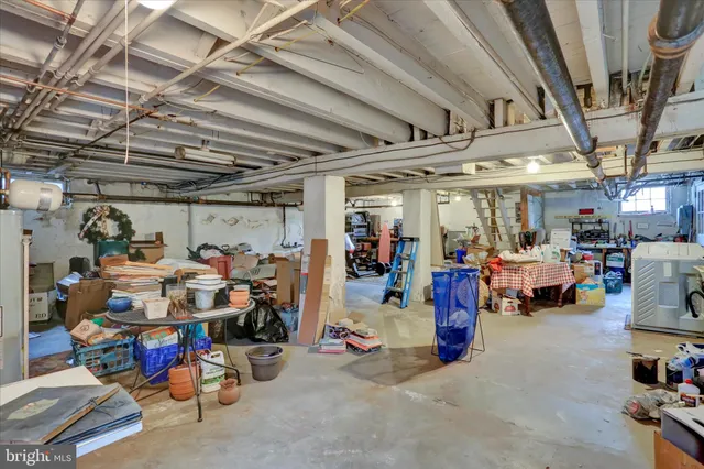 a bathroom with a granite countertop sink and a large mirror
